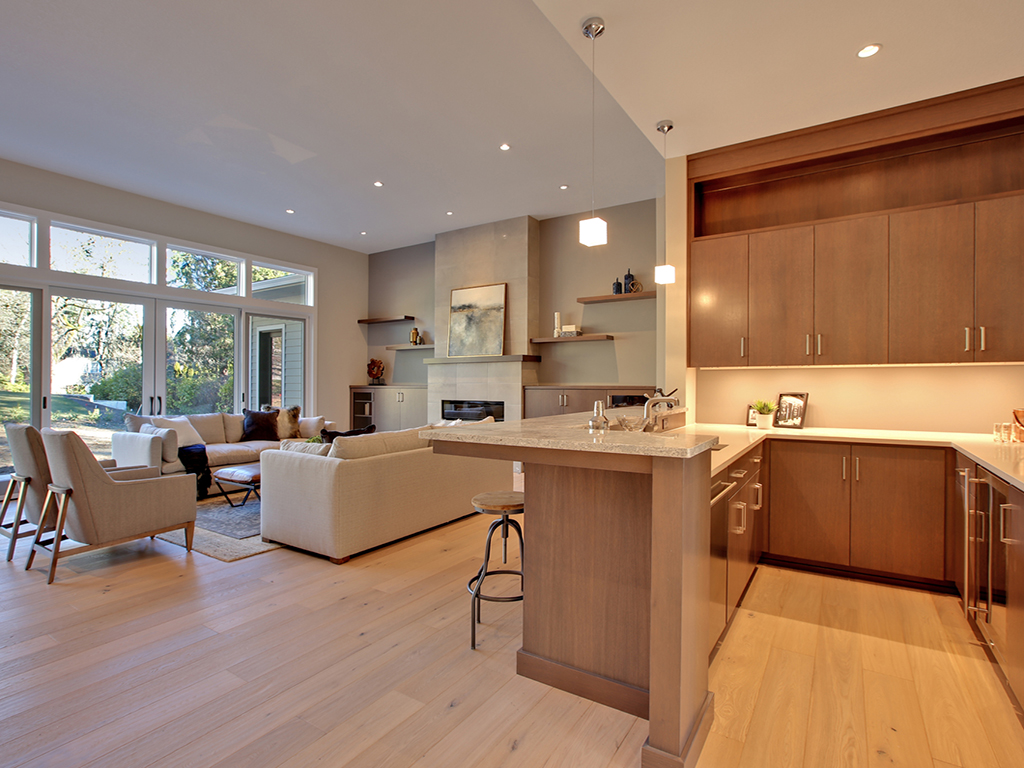 Bright open-concept living space and kitchen in a custom Lifestyle Homes residence