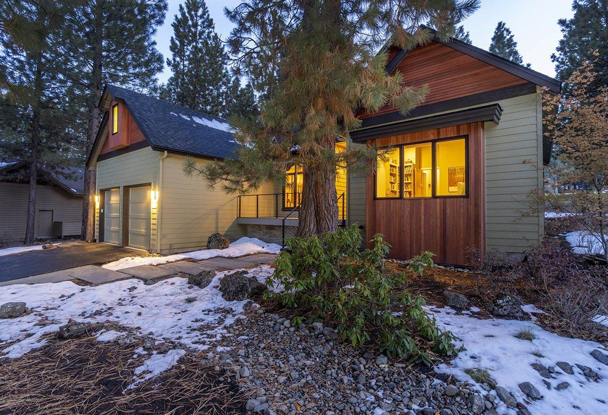 Covered patio overlooking the golf course fairway at the Awbrey Glen remodel in Bend, Oregon