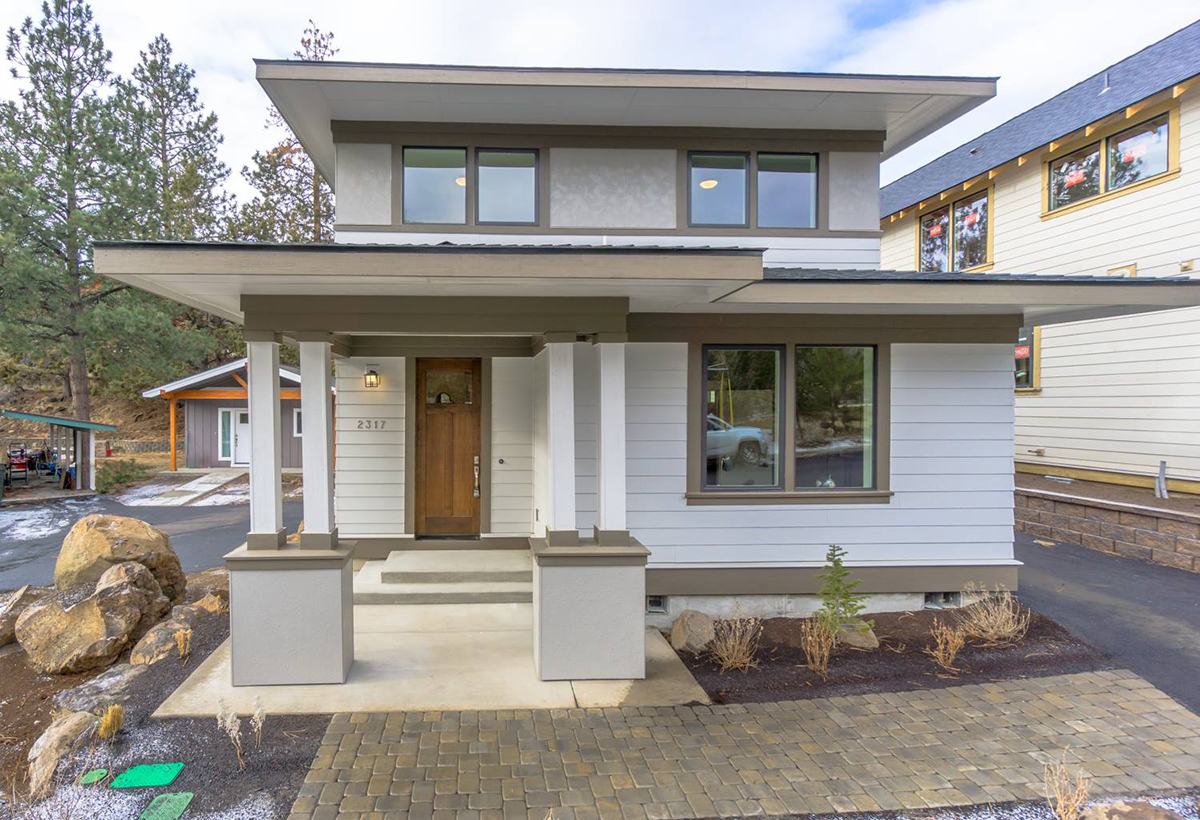 Open kitchen and dining space in the Awbrey Prairie home in Bend, Oregon
