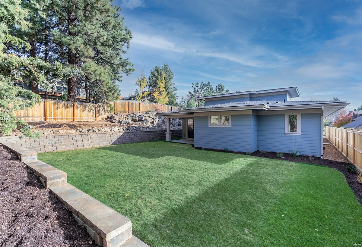 Backyard grass — Spacious prairie-style home with ADU