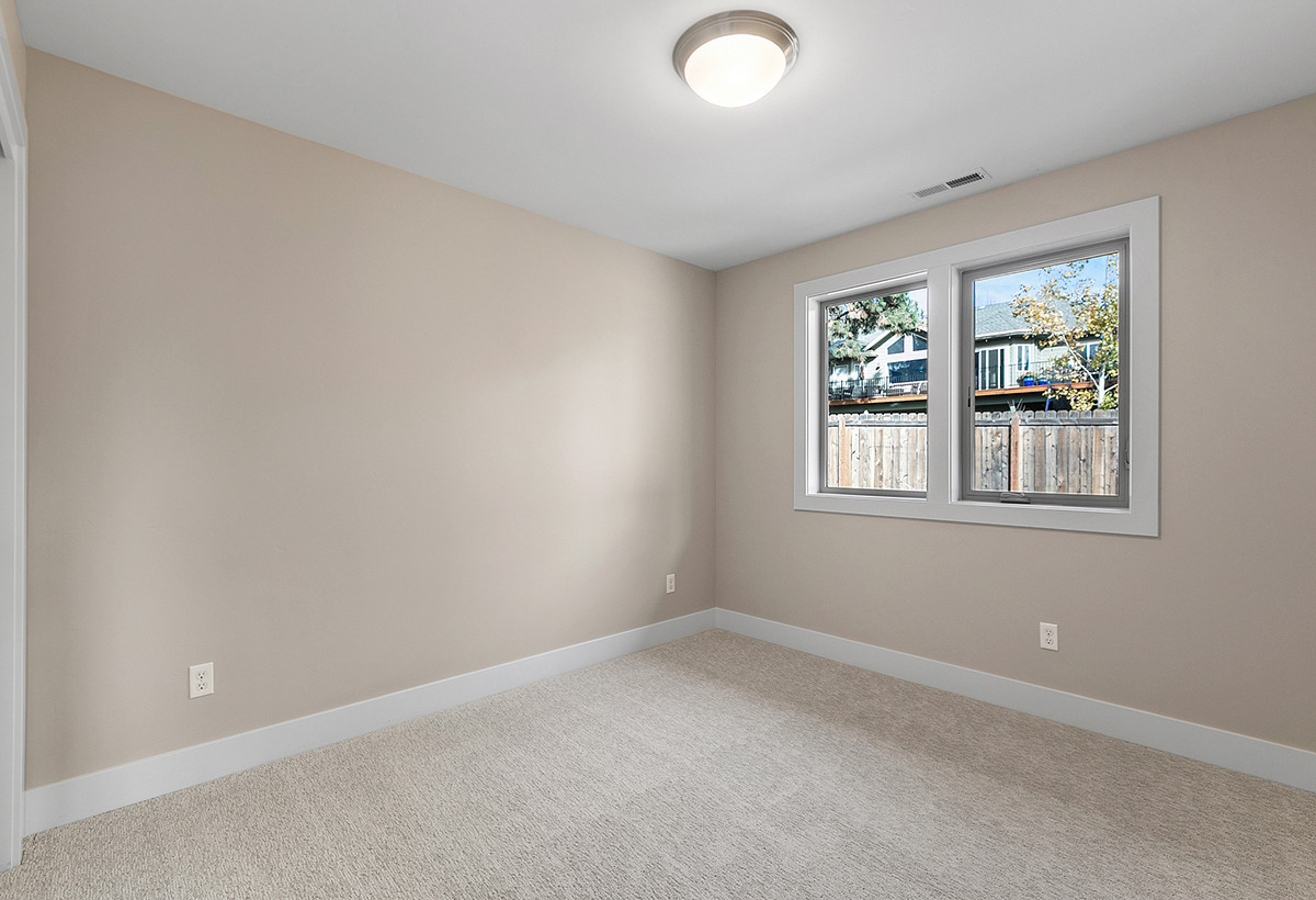 Bedroom downstairs — Spacious prairie-style home with ADU