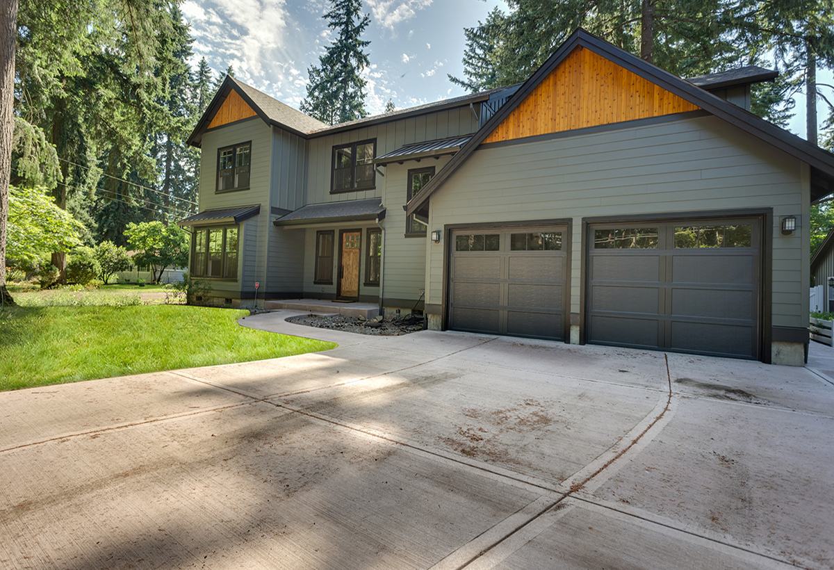 Bright kitchen with oversized island in the Kimball custom home in Lake Grove, Oregon