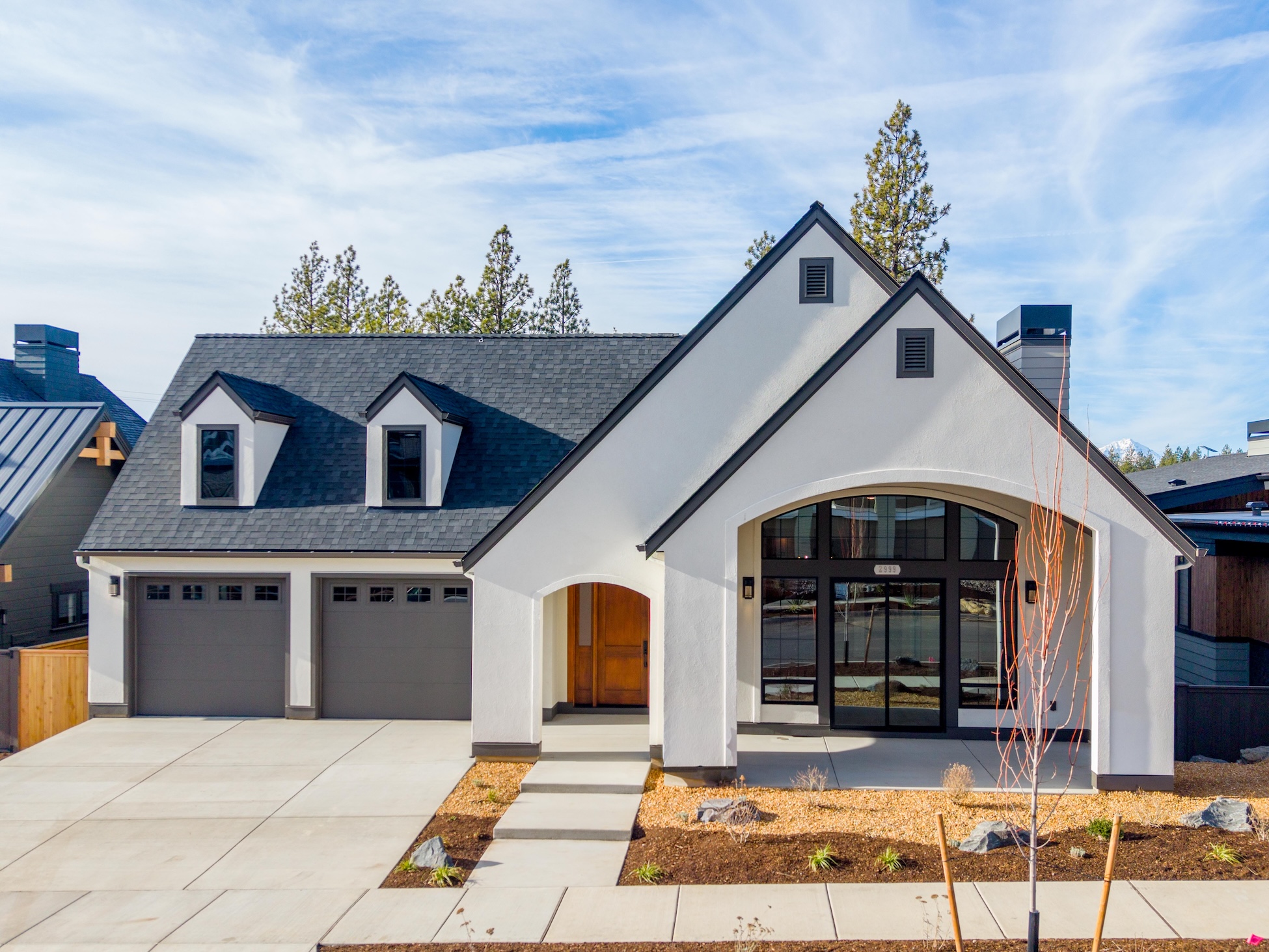 Exterior of the updated Tudor custom home with ADU on Talline Lot 45 in Bend, Oregon